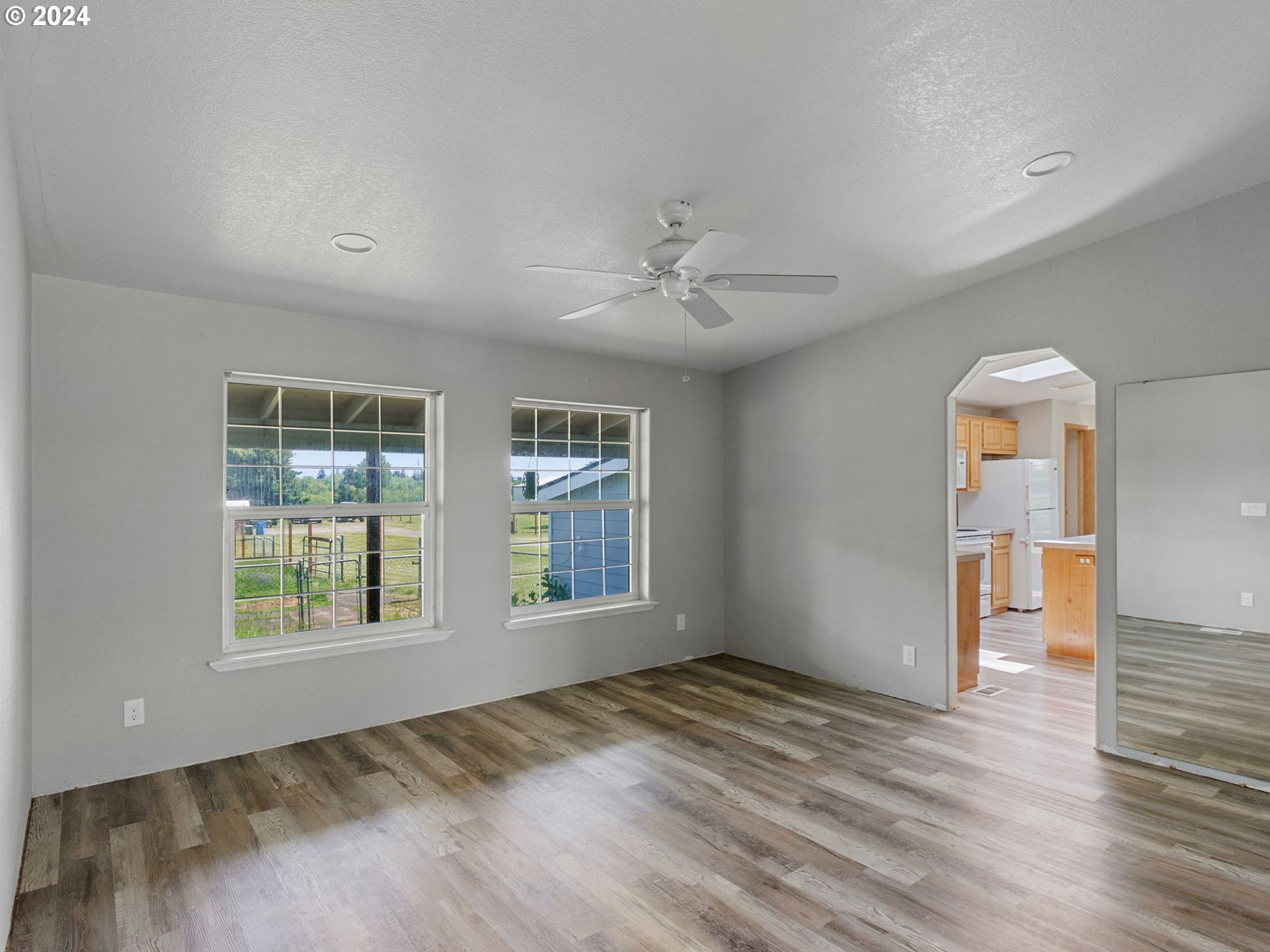 20221 Northeast 22nd Avenue Ridgefield, WA 98642 - Photo 22 of 39 wooden floor in an empty room with a window