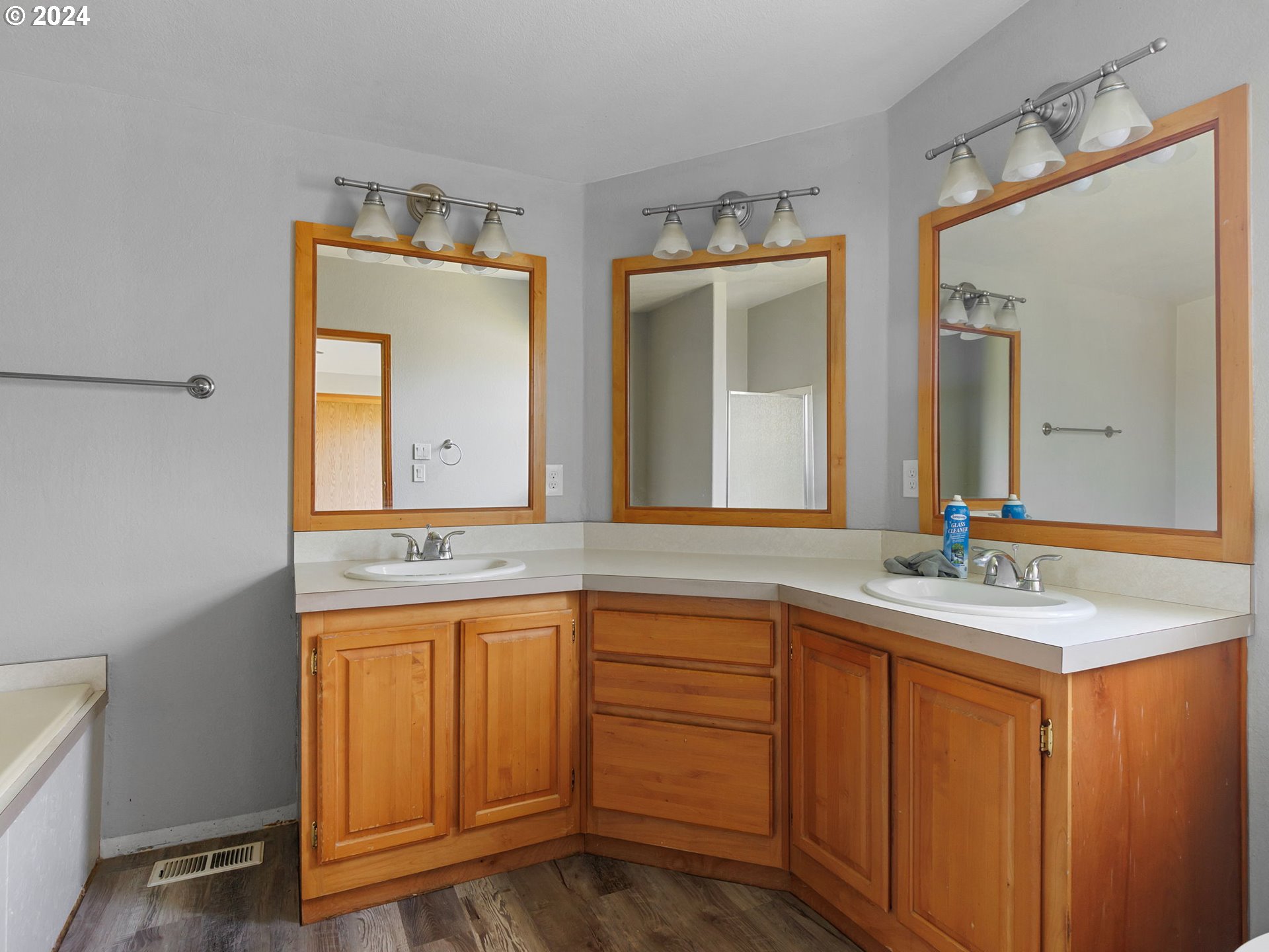 20221 Northeast 22nd Avenue Ridgefield, WA 98642 - Photo 27 of 39 a bathroom with a granite countertop sink and a mirror