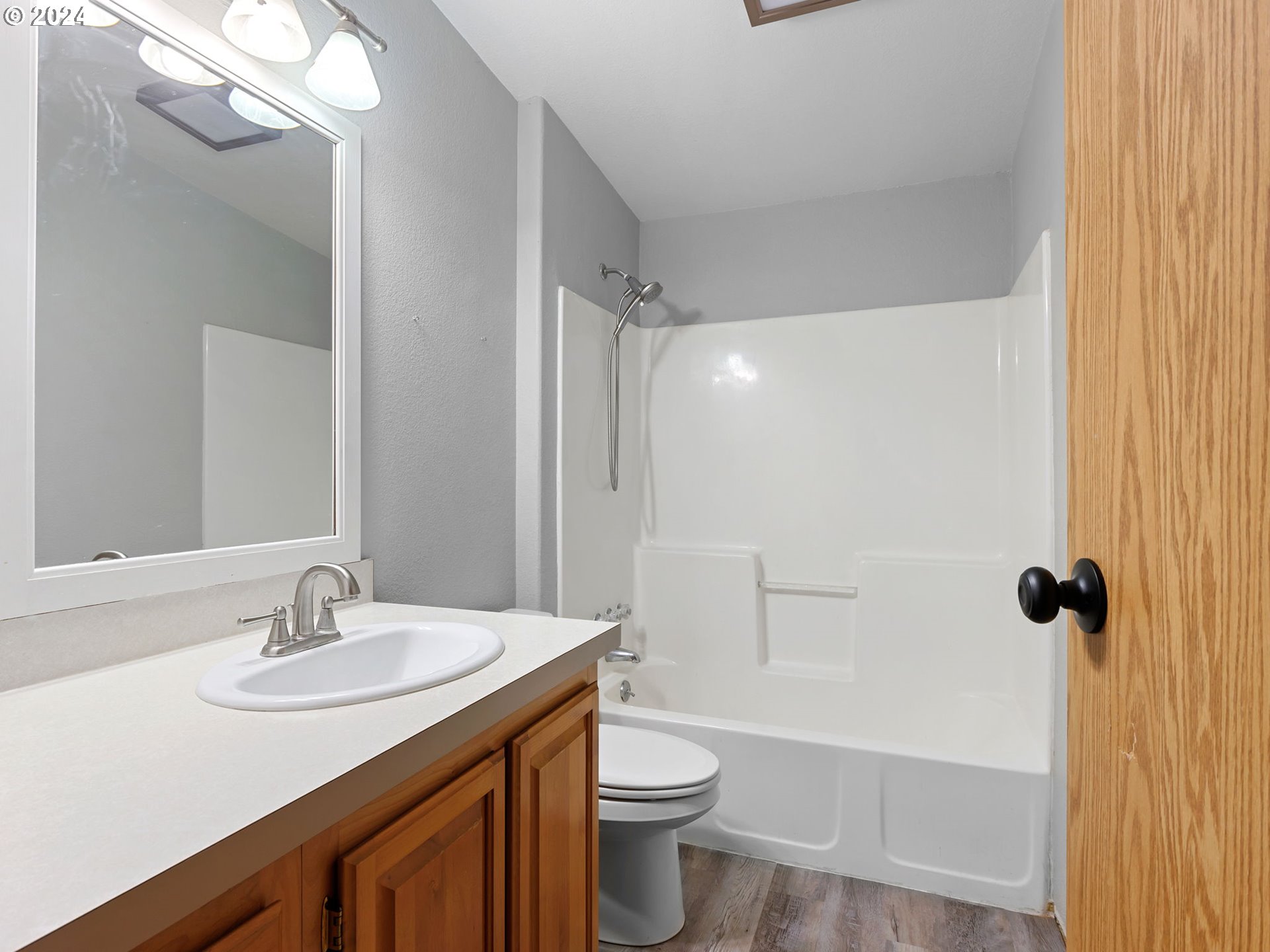 20221 Northeast 22nd Avenue Ridgefield, WA 98642 - Photo 29 of 39 a bathroom with a sink a toilet and shower