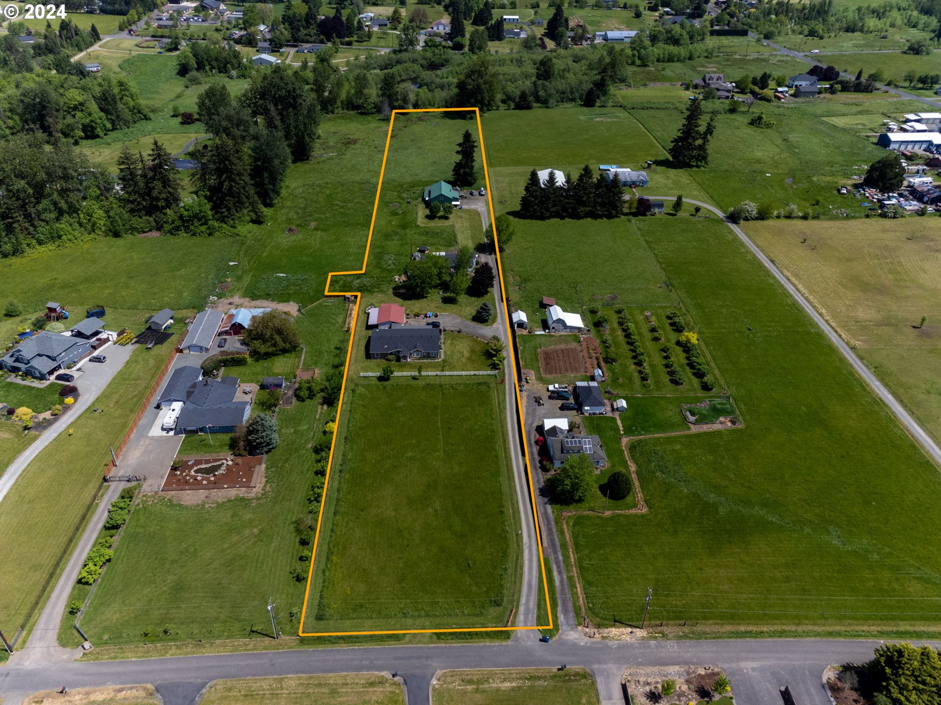 20221 Northeast 22nd Avenue Ridgefield, WA 98642 - Photo 3 of 39 an aerial view of a golf course with a swimming pool