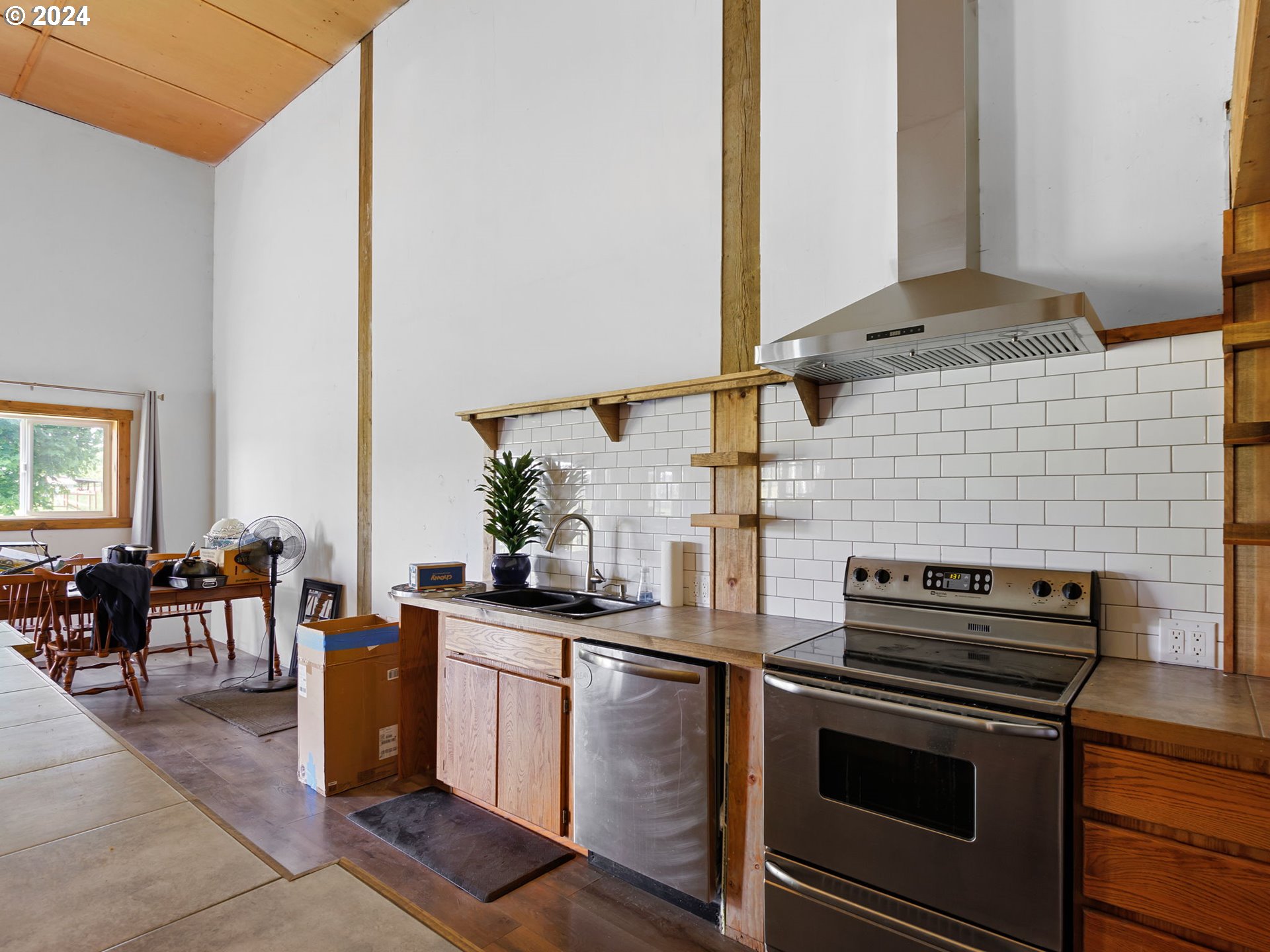 20221 Northeast 22nd Avenue Ridgefield, WA 98642 - Photo 34 of 39 a kitchen with a stove and a microwave