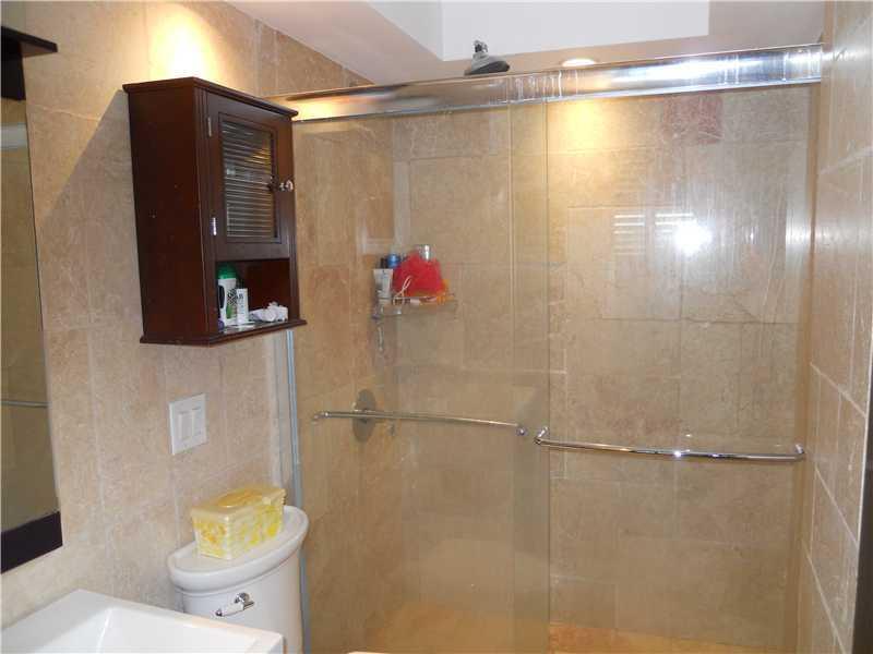 5321 Northeast 24th Terrace, Unit 512A Fort Lauderdale, FL 33308 - Photo 11 of 18 a bathroom with a shower and a toilet