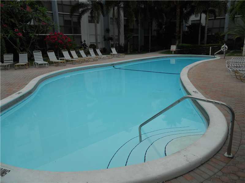 5321 Northeast 24th Terrace, Unit 512A Fort Lauderdale, FL 33308 - Photo 13 of 18 a view of a swimming pool with a patio