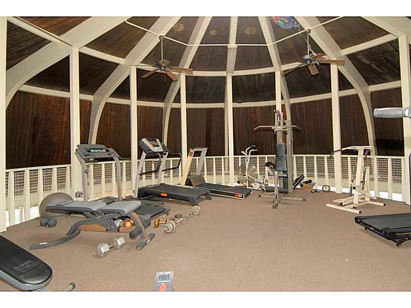 5321 Northeast 24th Terrace, Unit 512A Fort Lauderdale, FL 33308 - Photo 16 of 18 a room with gym equipment and a large window