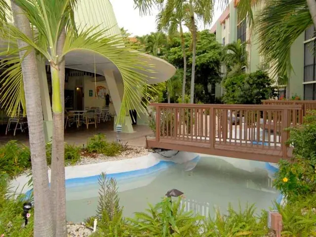 a swimming pool with outdoor seating and yard
