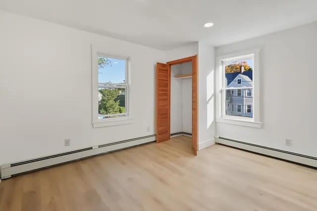 a view of an empty room with a window