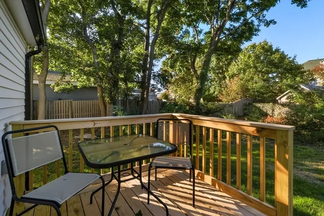 a view of a chairs and table in the balcony