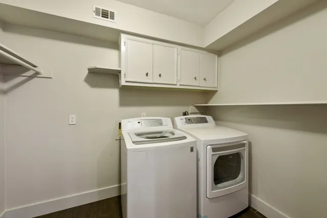 a utility room with dryer and washer