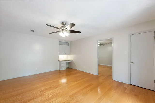 a view of a livingroom with a chandelier fan
