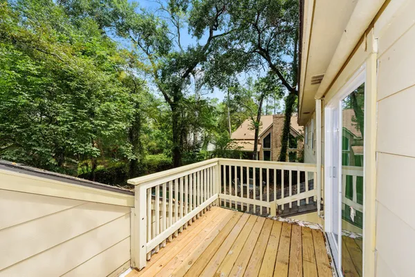 a view of balcony with deck and wooden floor