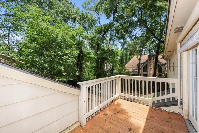 a view of balcony with wooden floor