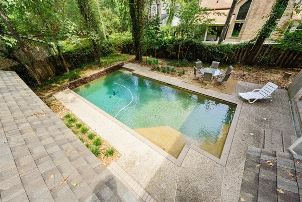 a view of a swimming pool with a patio