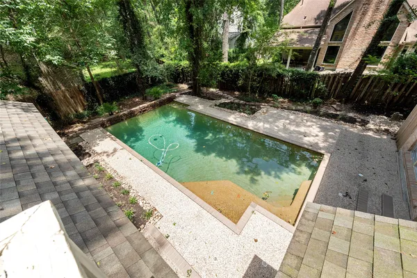 a view of a swimming pool with a patio