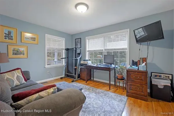 a bedroom with furniture and a window