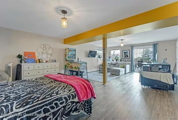 a bed room with a bed and balcony view