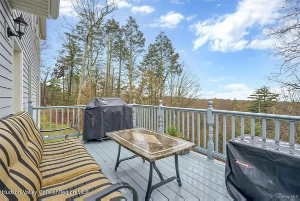 a view of a chairs and table on the deck