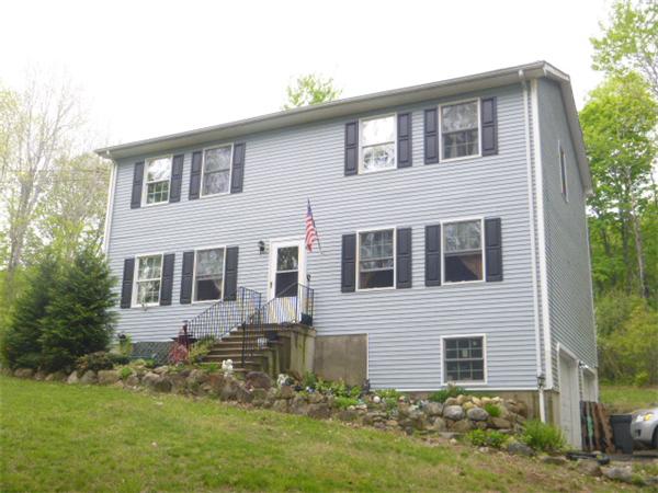 3730 Greenwich Road Hardwick, MA 01082 - Photo 1 of 15 a front view of a house with a yard and garage