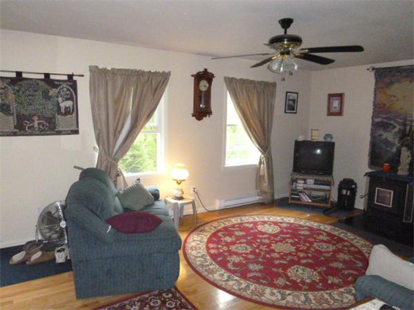 3730 Greenwich Road Hardwick, MA 01082 - Photo 6 of 15 a living room with furniture and a flat screen tv