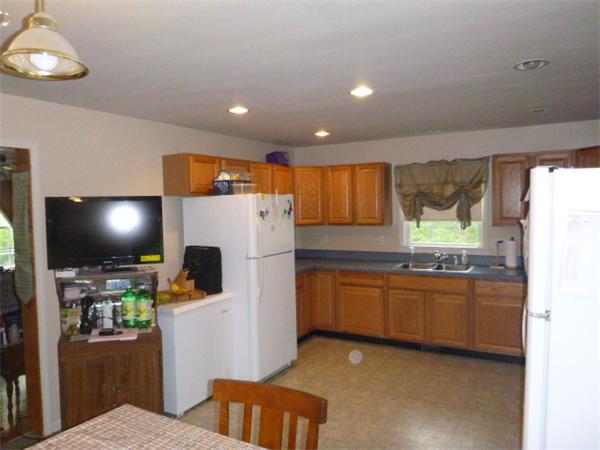 3730 Greenwich Road Hardwick, MA 01082 - Photo 10 of 15 a kitchen with stainless steel appliances kitchen island granite countertop a refrigerator and a stove top oven