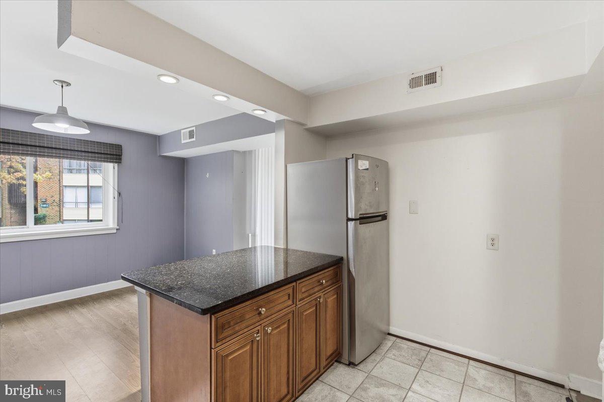 8459 Greenbelt Road, Unit T1 Greenbelt, MD 20770 - Photo 11 of 27 an empty room with window and hallway