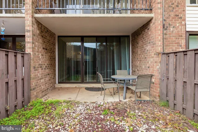 a living room with a table and chairs