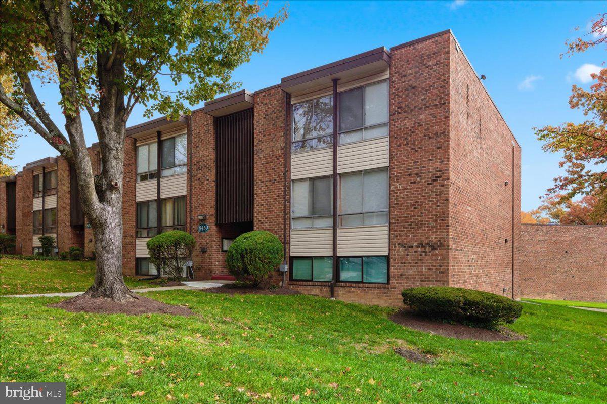 8459 Greenbelt Road, Unit T1 Greenbelt, MD 20770 - Photo 23 of 27 a front view of a building with a garden