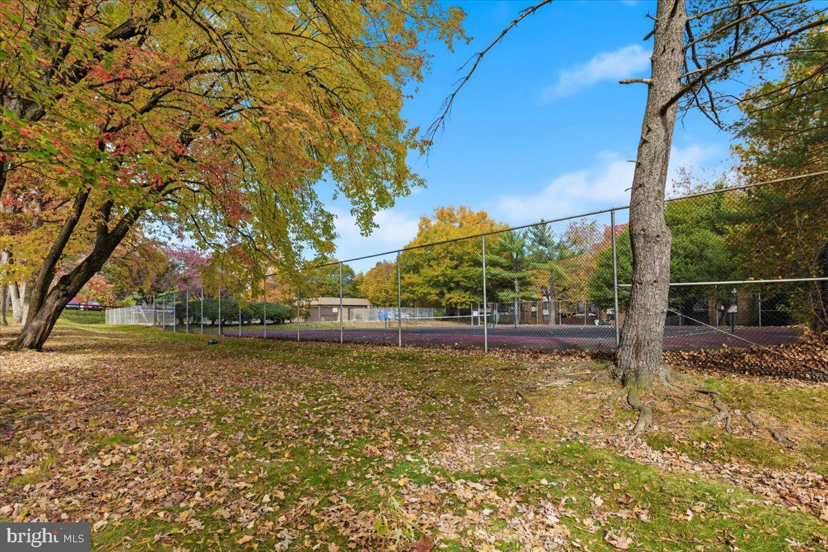 8459 Greenbelt Road, Unit T1 Greenbelt, MD 20770 - Photo 25 of 27 a view of a swimming pool with an outdoor space and seating area