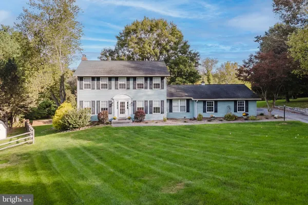 a view of a house with a yard porch and sitting area