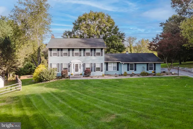 a view of a house with a yard porch and sitting area