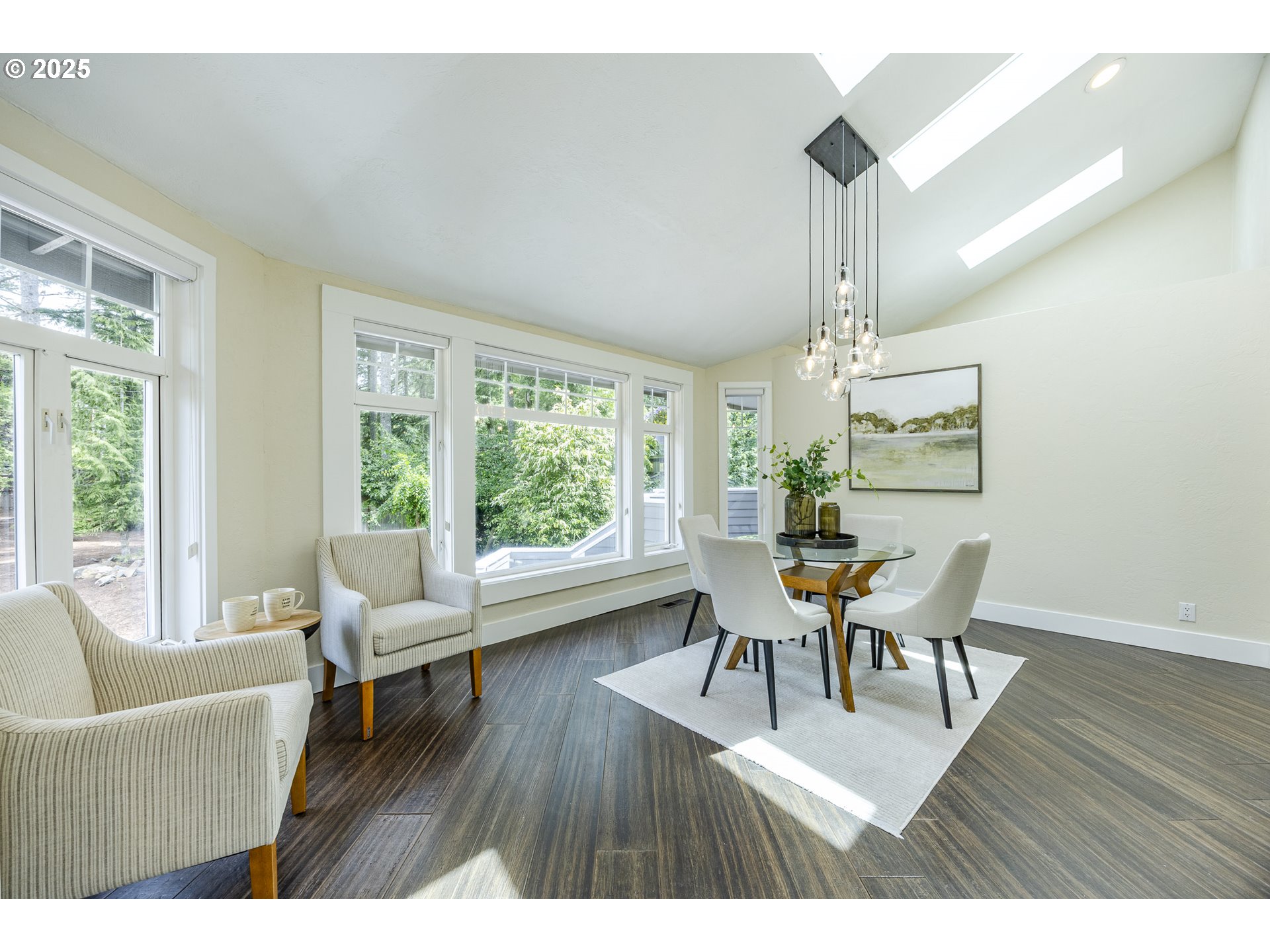 32518 Dillard Road Eugene, OR 97405 - Photo 18 of 45 a dining room with wooden floor a chandelier a glass table and chairs