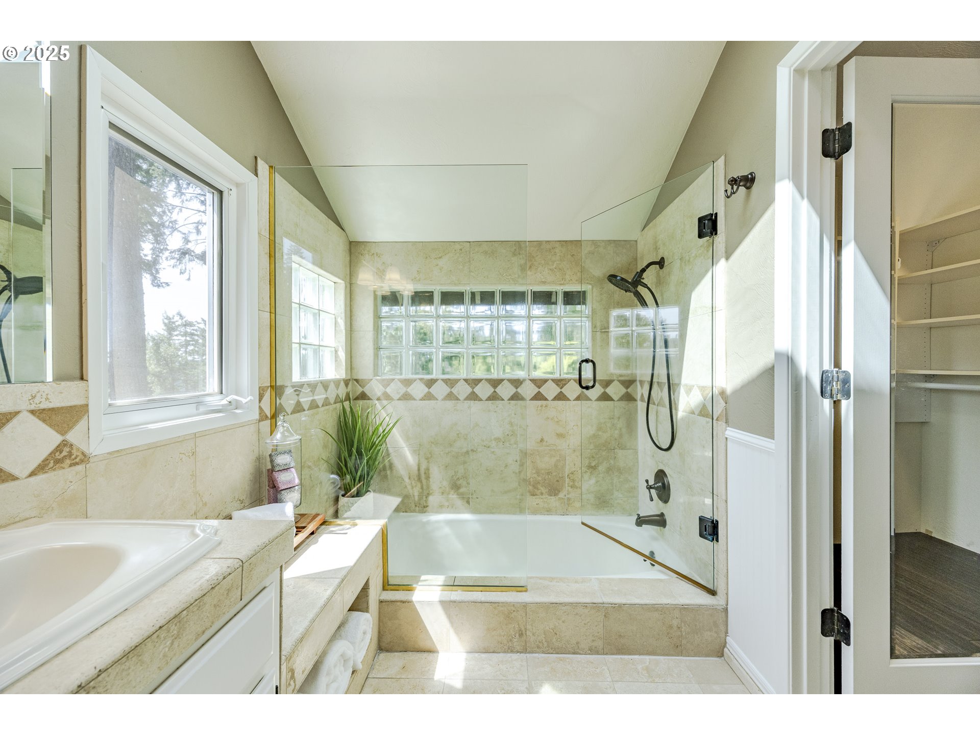 32518 Dillard Road Eugene, OR 97405 - Photo 27 of 45 a bathroom with a granite countertop sink a large mirror and a bathtub