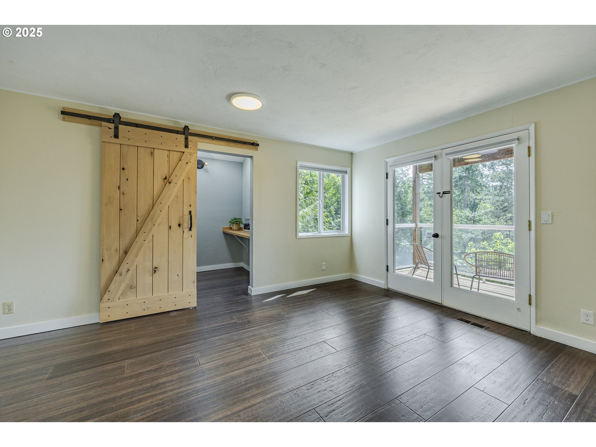 32518 Dillard Road Eugene, OR 97405 - Photo 36 of 45 a view of an empty room with wooden floor and a window