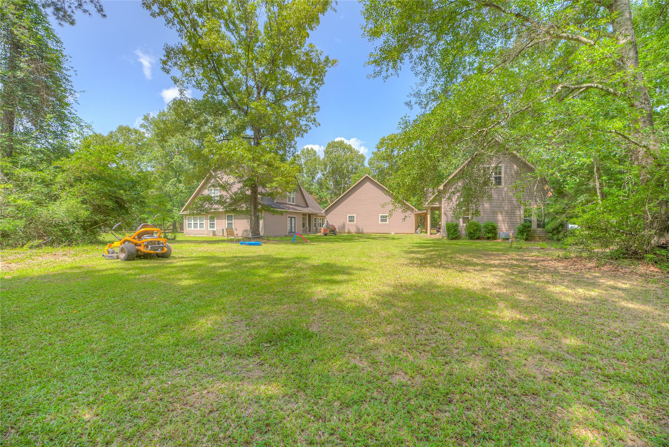 110 Happy Trails Road Coldspring, TX 77331 - Photo 35 of 49 a view of a house with a yard
