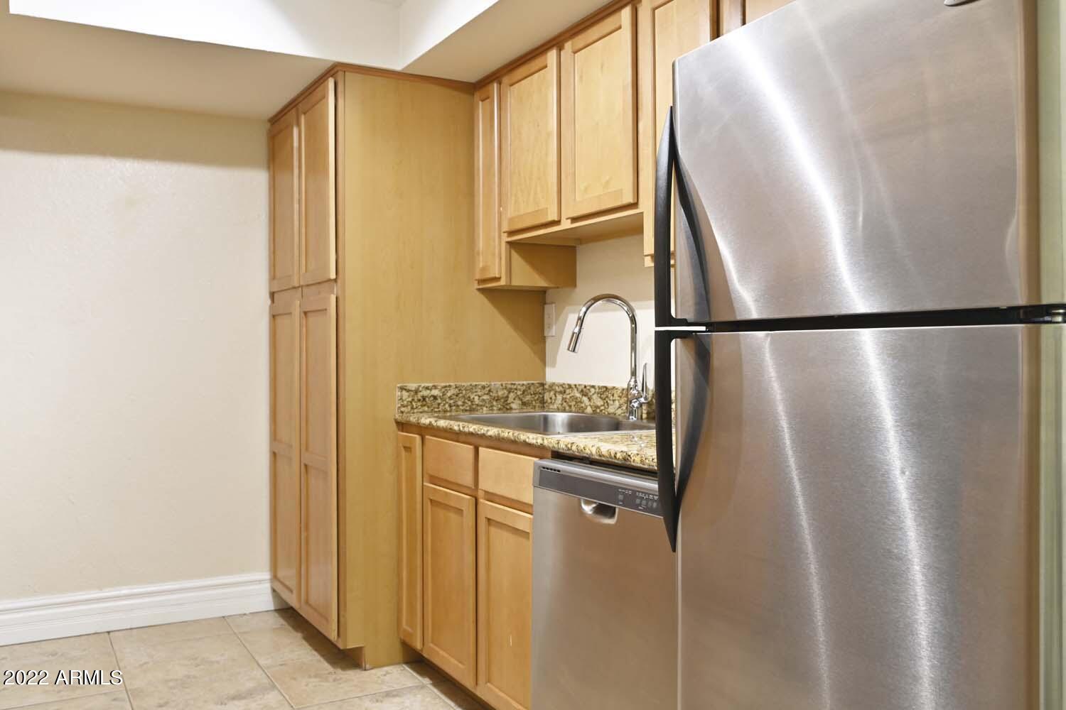 3825 East Camelback Road, Unit 243 Phoenix, AZ 85018 - Photo 7 of 20 Kitchen w_stacked washer_dryer