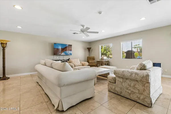 a spacious bedroom with a bed and window