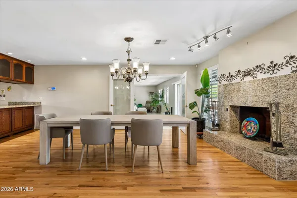 a view of a dining room with furniture and wooden floor