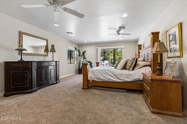 a large bathroom with a large tub shower and sink