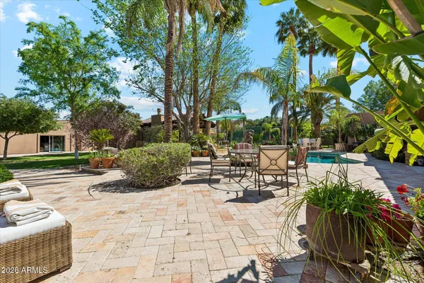 a view of swimming pool with outdoor seating