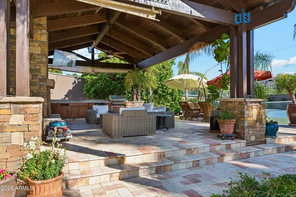 a view of swimming pool with outdoor seating