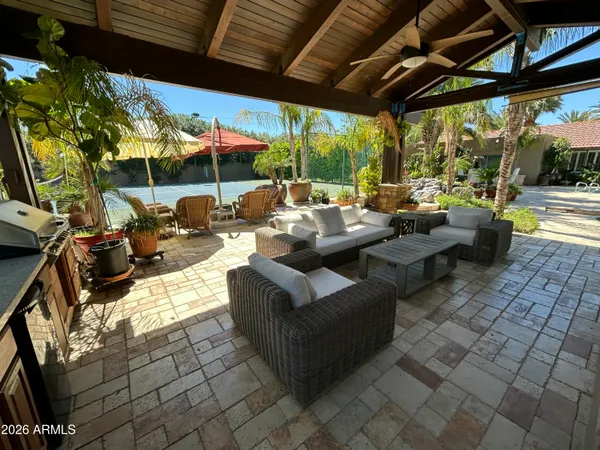 a view of a swimming pool with a patio