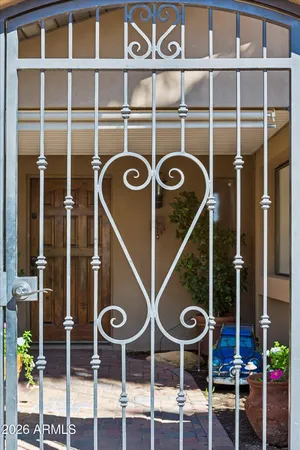 a view of a chairs and table in a patio