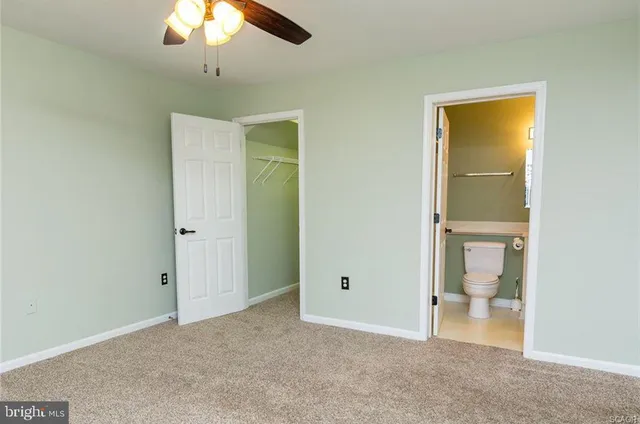 a view of an empty room with a bathroom