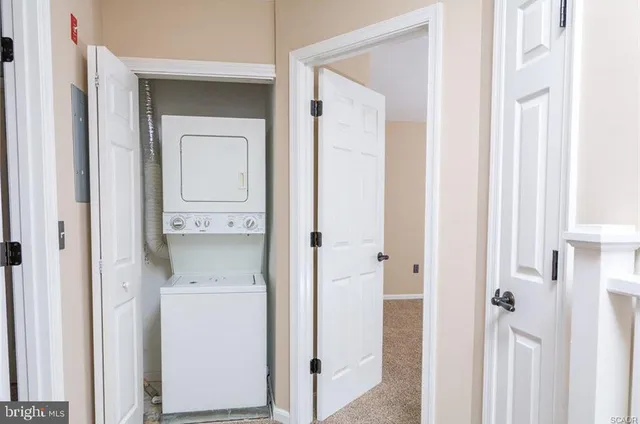 a view of a bathroom with a washer and dryer
