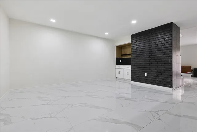 a bedroom with a bed and a potted plant