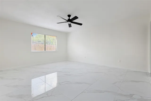 a bathroom with a shower toilet and sink