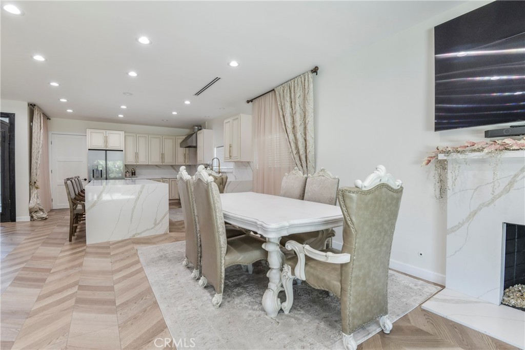 9728 Rhea Avenue Northridge, CA 91324 - Photo 9 of 36 a dining room with furniture a window and kitchen view