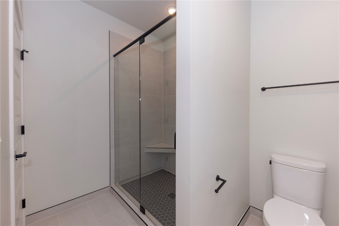 35 Argentine Court, Unit 202 Keystone, CO 80435 - Photo 8 of 34 a bathroom with a granite countertop toilet and a shower