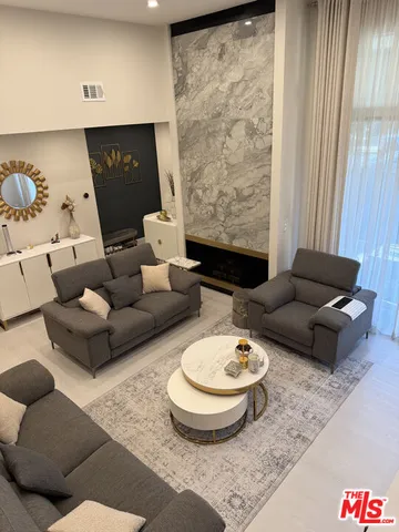 a living room with furniture and a rug