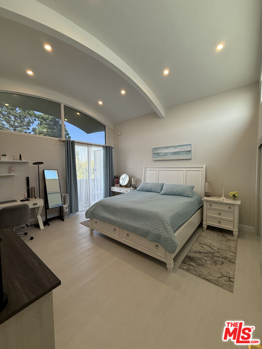 13218 Fiji Way, Unit J Marina del Rey, CA 90292 - Photo 20 of 33 a bedroom with a bed and a large window