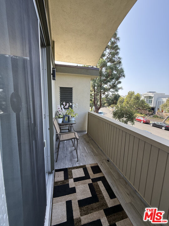 13218 Fiji Way, Unit J Marina del Rey, CA 90292 - Photo 21 of 33 a view of balcony and wooden floor